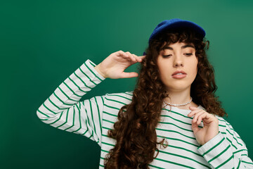 Young stylish woman expressing emotions against a vibrant green background