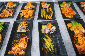assortment of meat and various Asian vietnamese dishes at buffet in the hotel restaurant in Asia