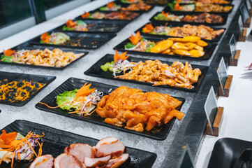 asian food and meat in self-service buffet in the hotel restaurant for breakfast in Asia in Vietnam