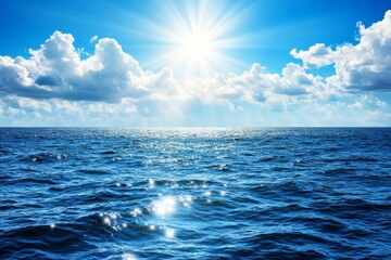 Obraz premium A serene ocean scene with the sun shining through clouds, casting rays of light on the calm waters. The sky is blue and white, creating an atmosphere of tranquility and peace. In front of it