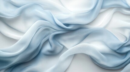 Obraz premium Delicate flowing blue and white fabric draped with soft shadows