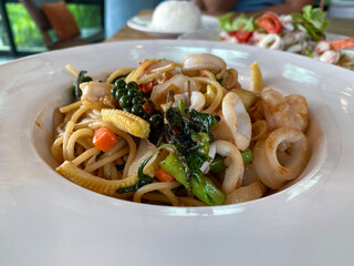 Thai spicy spaghetti with seafood and fresh pepper