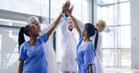 High five, group of nurses and doctors in healthcare with success, support and celebration for medical win at hospital. Men, women and health, diversity and teamwork, hands together for achievement