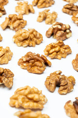Shelled walnuts on a white background close-up