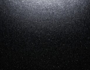 A shimmering black surface with a subtle sparkle effect, creating a dramatic and elegant ambiance.