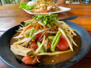 Jungle som tam, Thai spicy papaya salad with Vietnamese sausage