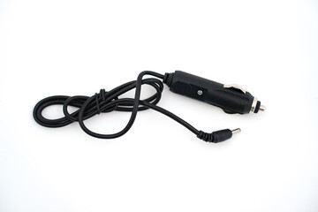 Fototapeta premium car adapter for Power bank with function of starting car on white background. jump starter is suitable for motors, power source for laptops, phones, tablets, other gadgets