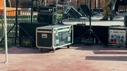Crates of stage equipment while assembling a mobile stage. High quality 4k footage
