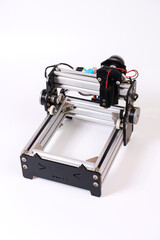 Mini Laser Engraving Machine for Wood on White Background. engraving handmade wood products and...