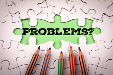 PROBLEMS? White puzzle pieces and colored pencils