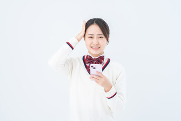 スマホを使う女子高生