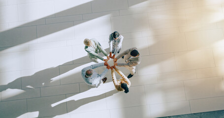 Top view of business people, fist bump and support in team, success and solidarity with mission and...