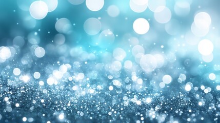 Abstract image featuring defocused sparkling bokeh lights in blue tones