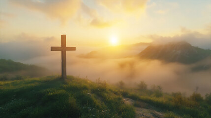 A wooden cross standing on a green hill at sunrise, with golden light shining through the clouds.