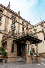 Fototapeta premium Seville, Andalusia, Spain; February 15, 2025: Entrance to the Alfonso XIII Hotel, built between 1916 and 1928 for the Ibero-American Exposition of 1929.