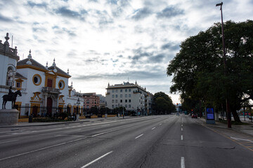 Fototapeta premium Cristobal Colon Avenue and the Maestranza bullring in the early morning. Seville, Andalusia, Spain.