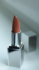 red lipstick on white background