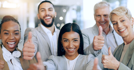 Obraz premium Happy business people, thumbs up and portrait at office in success, teamwork or good job together. Group of employees smile and like emoji, yes sign or OK in team, winning or achievement at workplace