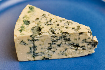 a piece of dorblu cheese on a plate