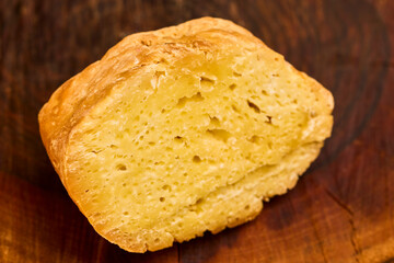 a piece of aged cheese on a wooden platter