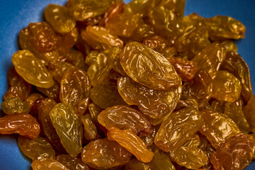 large golden raisins on a plate