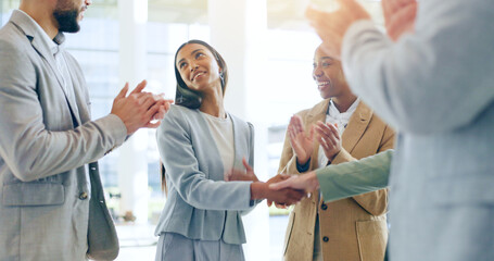 Obraz premium Business people, handshake and applause in teamwork for hiring, promotion or b2b deal at office. Happy woman shaking hands with group clapping in team recruiting, meeting or agreement at workplace