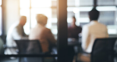 Business people, meeting and corporate discussion against a blurred background at the office. Group...