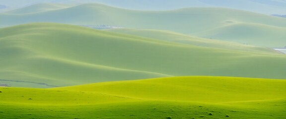 Obraz premium Serene Green Hills: Rolling Landscape, Tranquil Nature, Peaceful Meadow, Overcast Sky, Natural Background, Idyllic Scenery, Calm Horizon