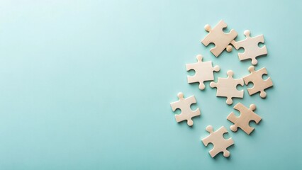 Unassembled Wooden Puzzle Pieces on a Light Blue Background Representing Teamwork and Problem Solving
