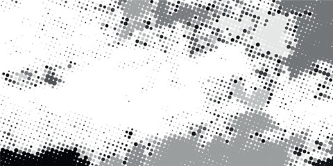 Halftone faded gradient texture. Grunge halftone grit background. White and black sand noise wallpaper.