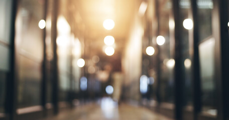 Professional, blurry and walking in lobby to meeting for planning with staff at company. Closeup, business and employees in corridor at corporate office for career or working together for job.