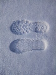 Two boot prints in the snow