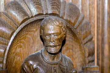 Carved Merchant’s Portrait on an Antique German Oak Cabinet