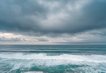 Obraz premium Ocean with rough waves, ocean horizon, rough sea, stormy weather, wide view, sky background, blue and gray color palette
