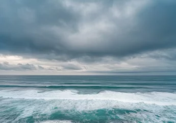 Store enrouleur  Ocean with rough waves, ocean horizon, rough sea, stormy weather, wide view, sky background, blue and gray color palette  © Johaness