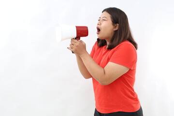 Serious woman of Asian hold scream shout in megaphone announces discounts sale Hurry up isolated on white background studio portrait.