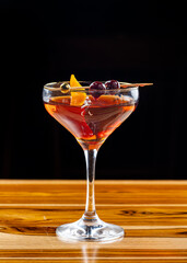 orange cocktail on a black background