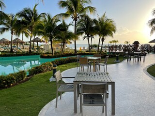 sunset over the swimming pool in the tropical resort