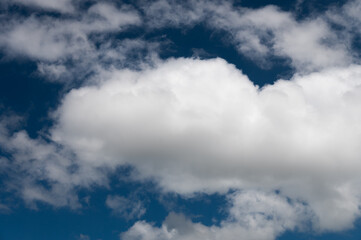 Beautiful blue sky with white fluffy big clouds
