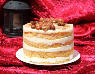 Tiramisu mousse cake on a red silk tablecloth