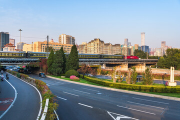 The scene of vehicles flowing continuously on the urban roads in Beijing, China