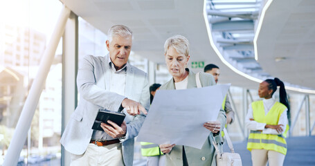 Obraz premium Business people, blueprint and tablet for architecture, talking and planning with engineer group, partner and analysis. CEO man, women and paperwork with pointing, advice or questions for property