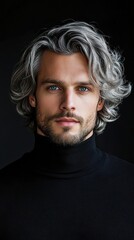 Fototapeta premium A man with a gray haired mane and a beard is wearing a black shirt