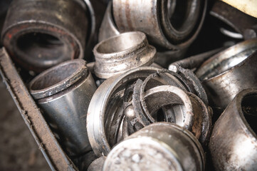 Dirty metal waste from car suspensions. Scrap metal in a landfill. Metal recycling