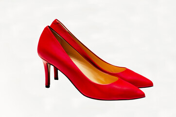 Elegant red high-heeled pumps isolated on white background. stiletto heels