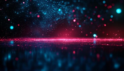 Fototapeta premium A vibrant, abstract background featuring sparkling particles in shades of blue, pink, and red, creating a cosmic and dynamic atmosphere.