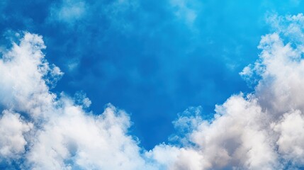 Plane flying through a clear blue sky with fluffy white clouds in the background on a sunny day