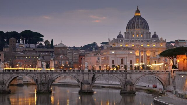 Panning shot of St. Peter's Basilica and Sant Angelo Bridge in Vatican, Rome, Italy. Birds fly at sunset against the backdrop of evening Rome with city lights. HDR shot