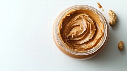 A close-up view of a jar filled with smooth peanut butter ready for spreading and enjoying