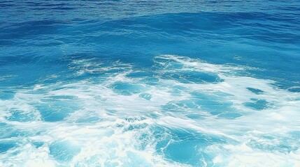 Obraz premium Pure blue turquoise water texture of the ocean sea with foam from and waves
